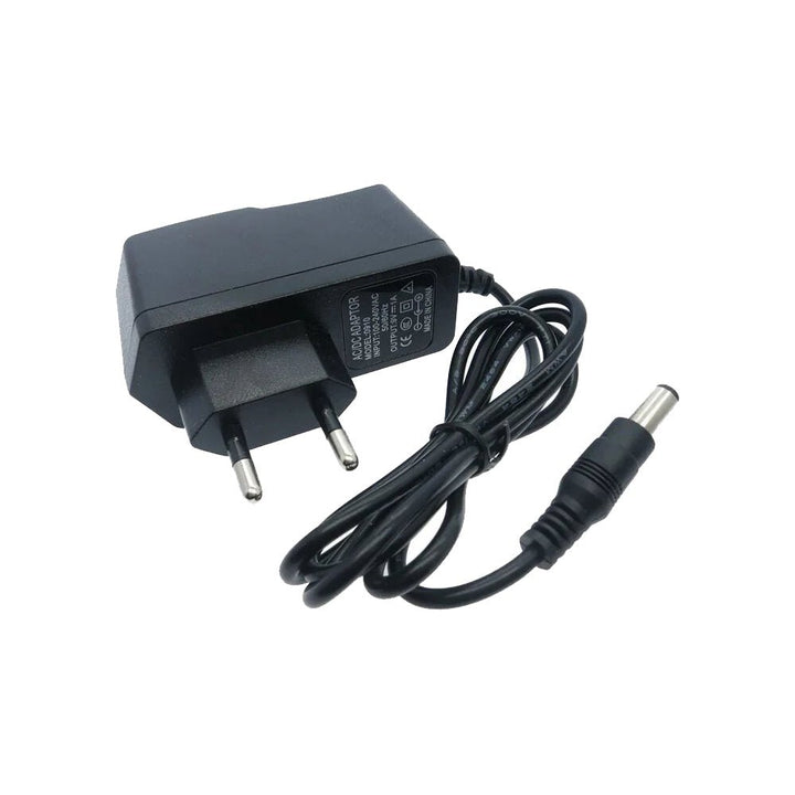 Cargador Eliminador 9v 1a Plug 2.1mm + Adaptador Universal - Tecneu